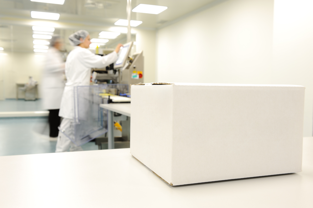 Crate in front of medical staff in modern factory