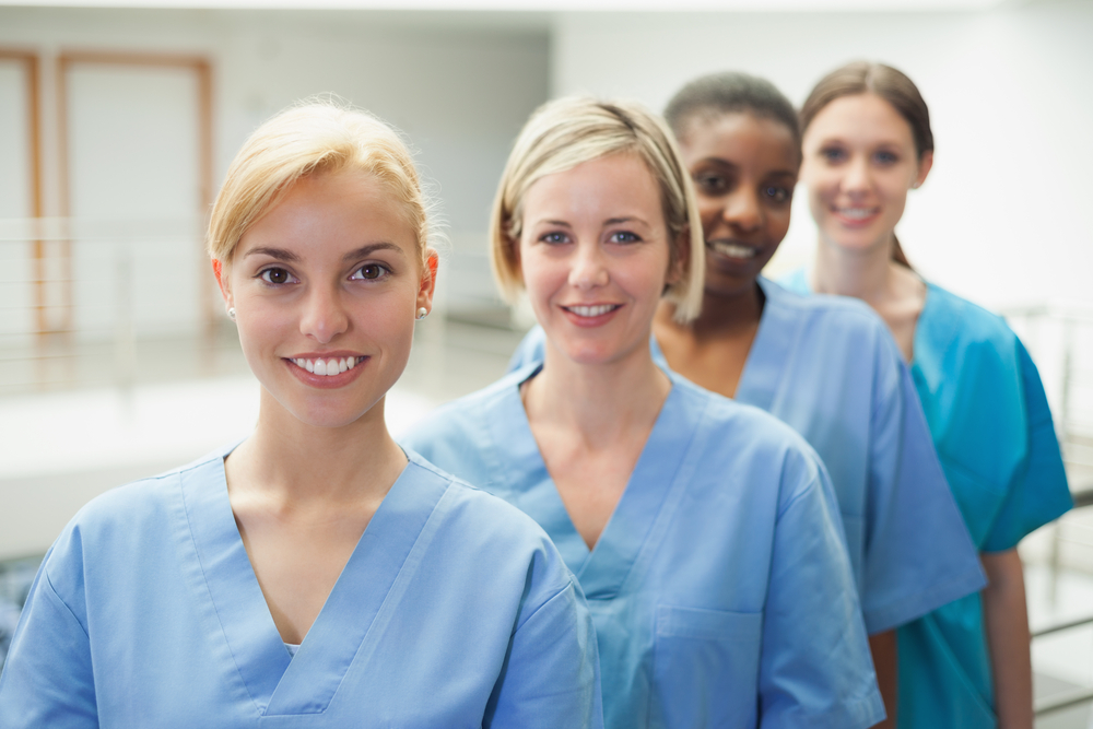 Female nurse looking at camera in hospital hallway-4