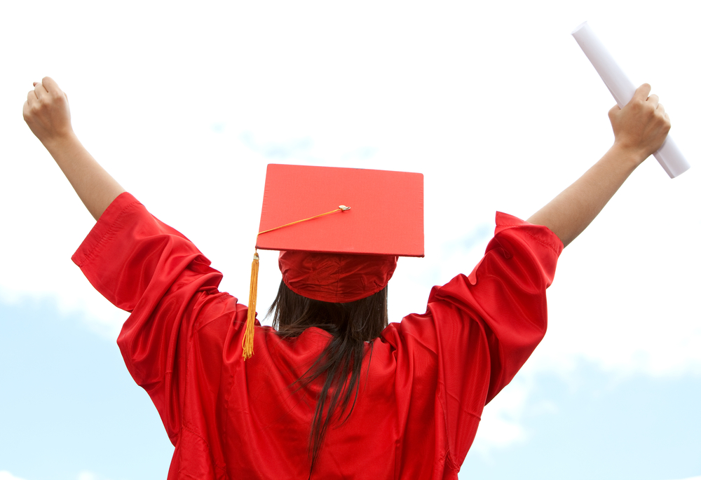 Graduate student celebrating her academic success